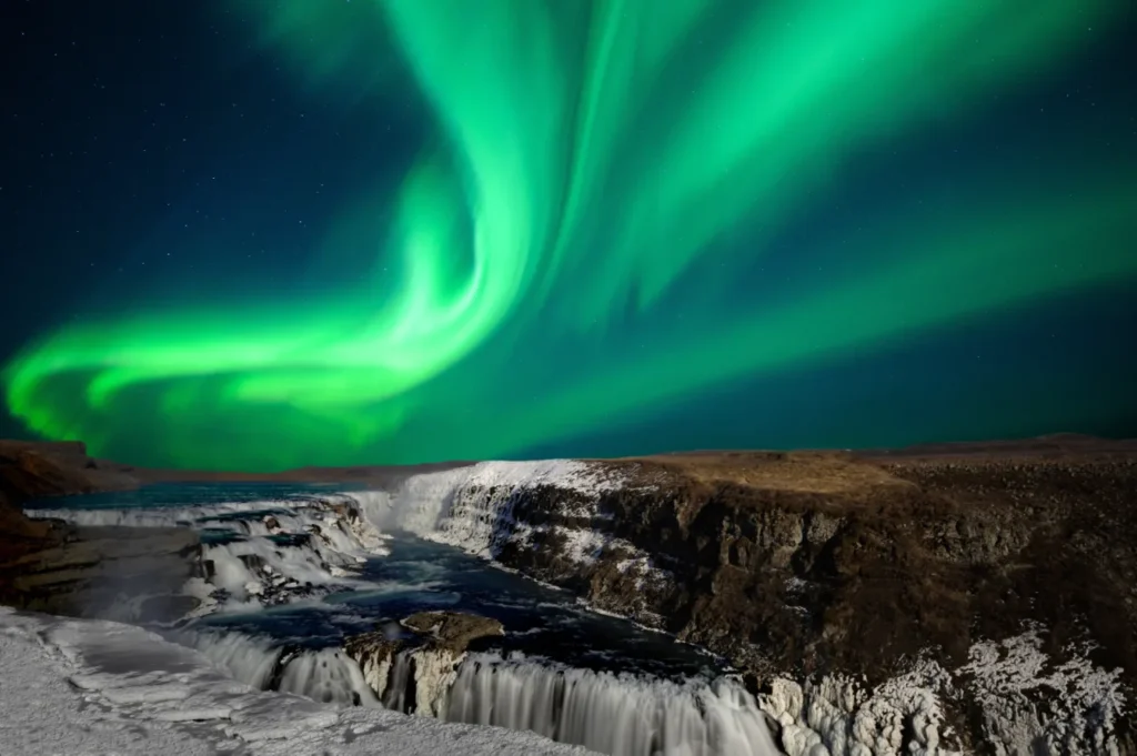 Gullfoss waterfall under northern lights